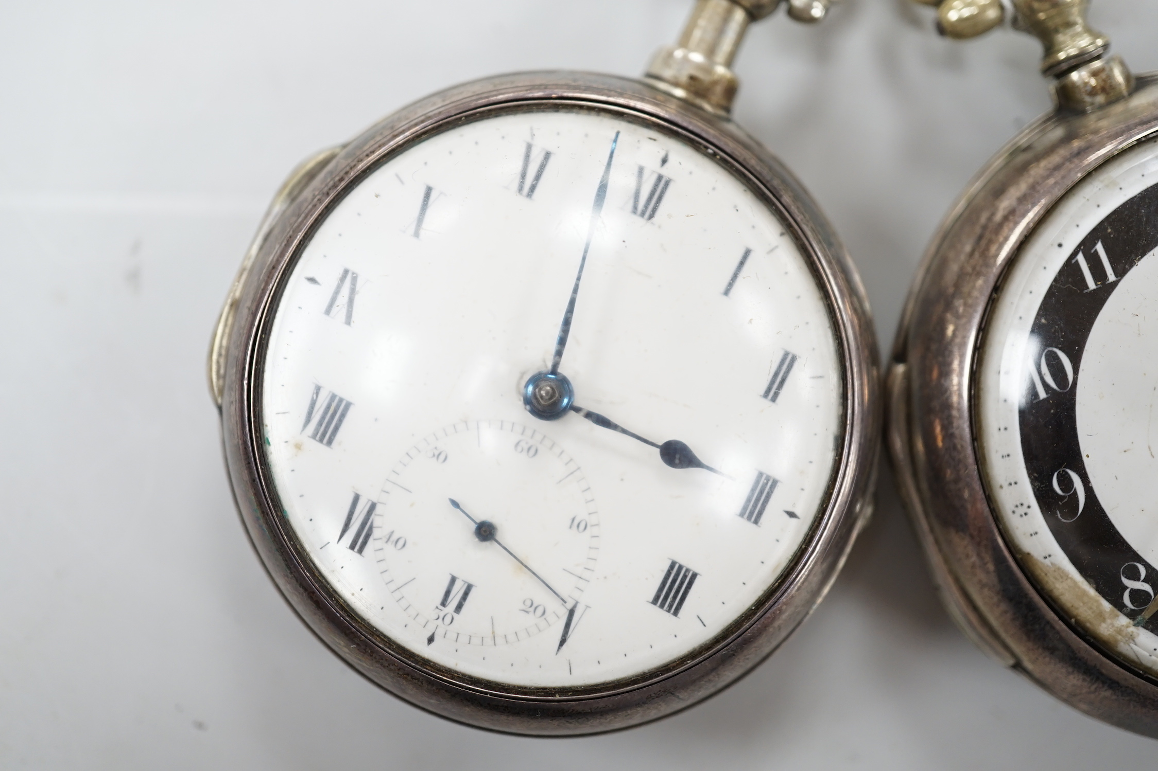 Two George III silver pair cased keywind verge pocket watches by Knight of Thaxted (black ring) and Spink of Windsor.